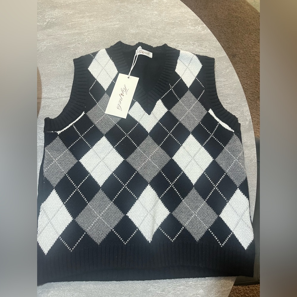 Brand new with tags. Cute vest